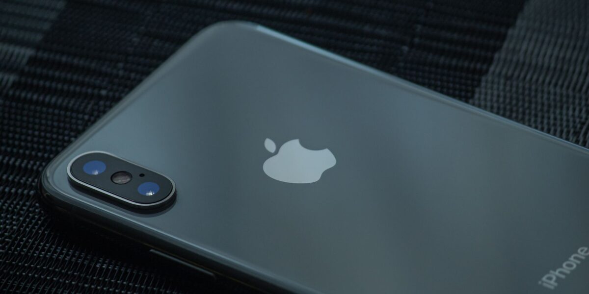 High-quality close-up of a sleek smartphone's back, showcasing the camera and logo.