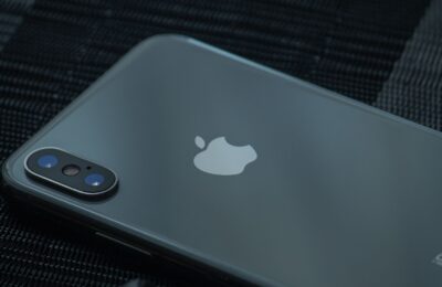High-quality close-up of a sleek smartphone's back, showcasing the camera and logo.