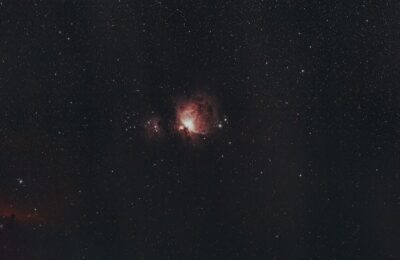 A captivating image of the Orion Nebula under a clear starry sky, showcasing the wonders of the universe.