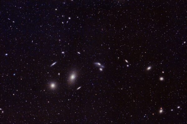 Captivating image of distant galaxies and star clusters in the vast universe. Perfect for astronomy enthusiasts.
