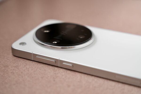 Detailed shot of a smartphone's sleek camera module, showcasing its design and features.