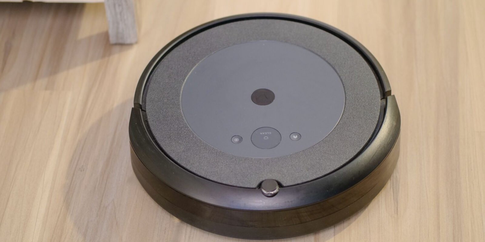 High-tech robotic vacuum cleaner efficiently cleaning modern floor indoors.